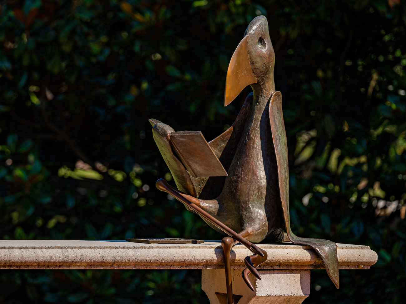 Reading bird sculpture